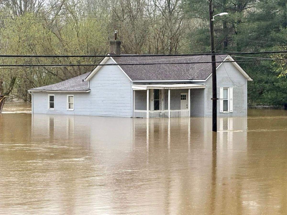 Floodwaters continued to rise Sunday, April 6, 2025 in Falmouth. Pendleton County officials issued emergency evacuation orders for Falmouth and Butler on Saturday, and access to much of Falmouth and all of Butler was cut off Sunday.