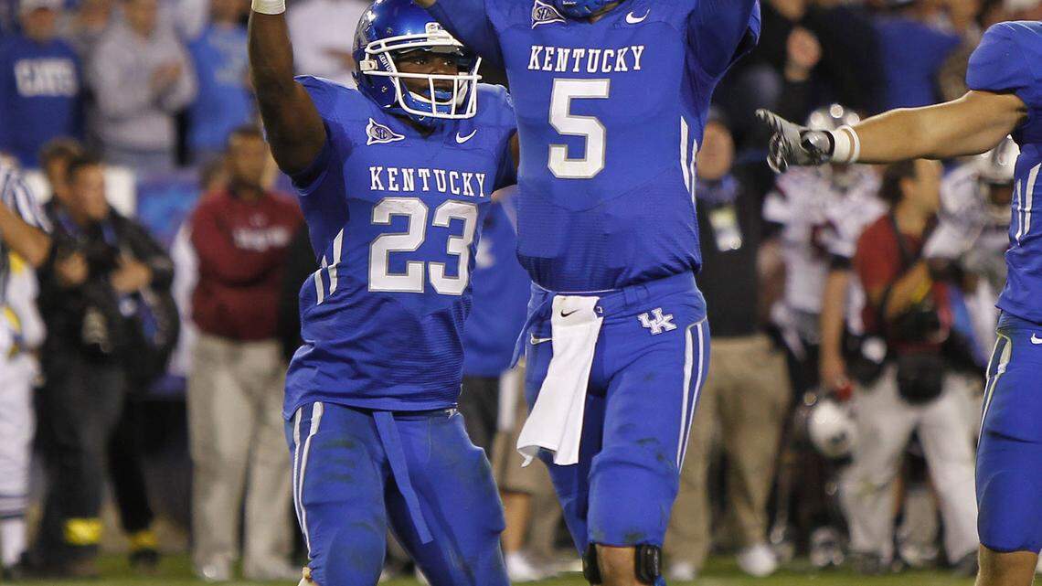 Quarterback Mike Hartline (5) ﻿completed 32 of 42 passes for 349 yards and four touchdowns in Kentucky's victory.    