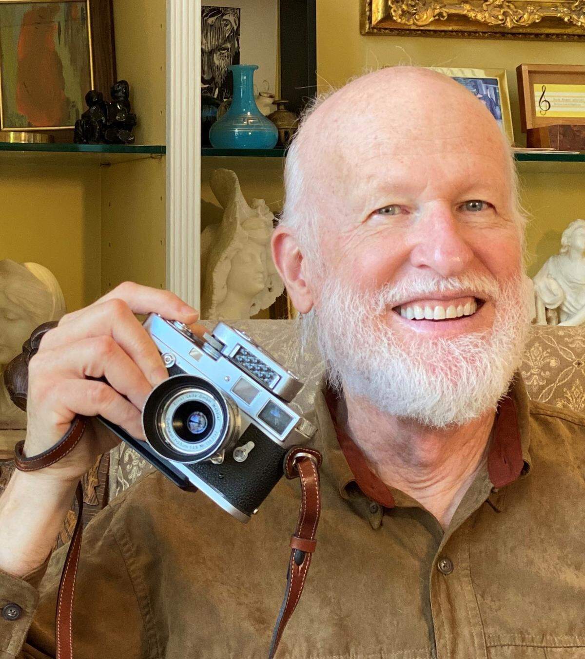 Bob Willcutt with his 1961 Leica camera.