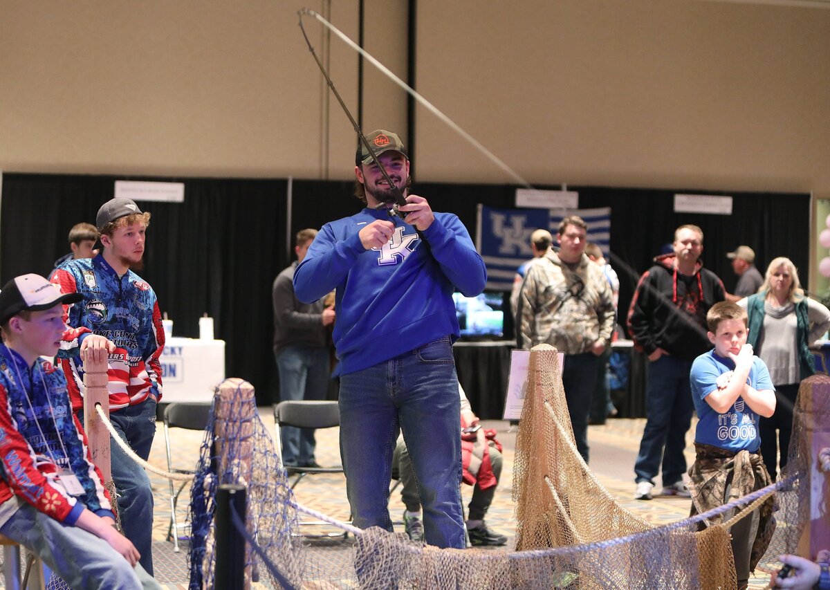 UK Football’s Kash Daniel, who is also a member of the UK Bass Fishing Team, fished on the simulator Sunday at the Kentucky Sport Boat and Recreation Show. Photo by Matt Goins