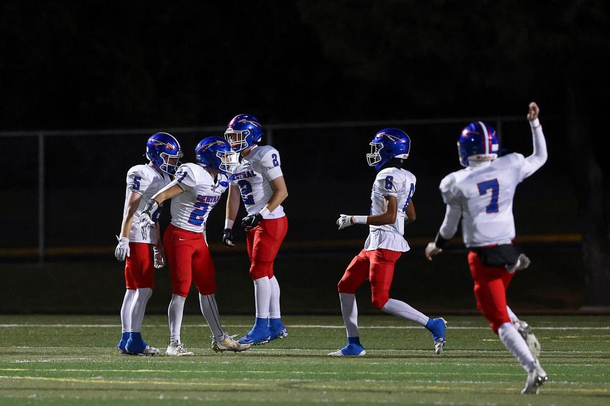 Madison Central’s Bryant Mathis (21) celebrates scoring a touchdown against Paul Laurence Dunbar during their first-round playoff game at Jon R. Akers Stadium on Friday.