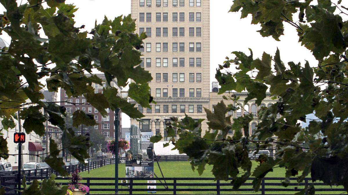 The 15-story First National Building at 167 West Main Street will be converted into a 21c Museum Hotel in an estimated $38 million project. The hotel will include 80 guest rooms, a restaurant and a bar. 