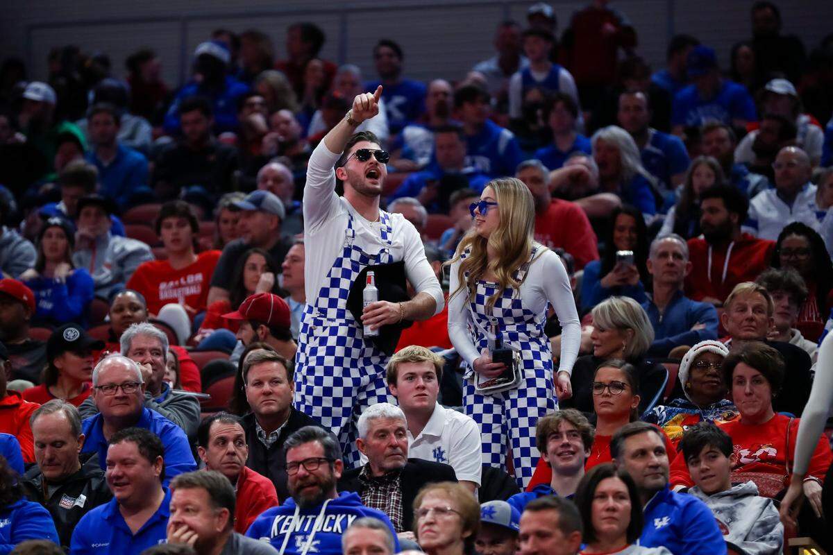 Kentucky fans cheer on their team against Louisville during Thursday’s game at the KFC Yum Center.