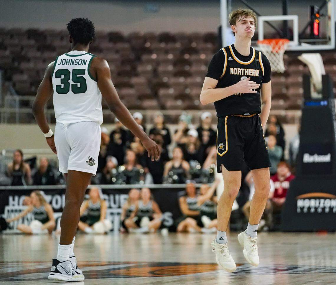Northern Kentucky guard Sam Vinson, right, celebrates near Cleveland State forward Deante Johnson after making a shot in the Horizon League Tournament finals in Indianapolis.