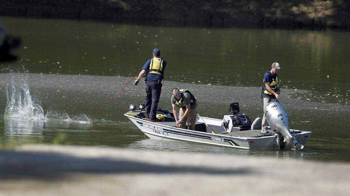 Emergency personnel from Jessamine County Fire & Rescue threw out lines Thursday as they  searched the Kentucky River for the body of Jacob Mulcahy, 17.