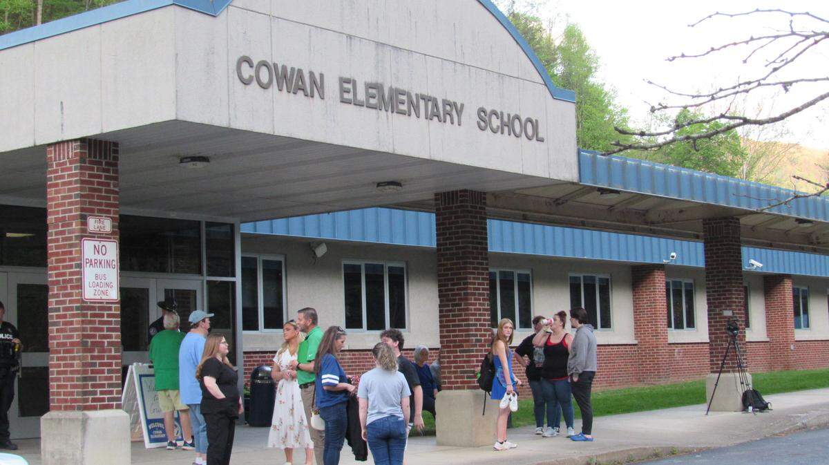 Parents gathered outside Cowan Elementary School in Letcher County on April 28, 2025 after the school board met at Cowan and voted to close Arlie Boggs Elementary School. Students from Arlie Boggs will be moved to Cowan for the 2025-26 school year.