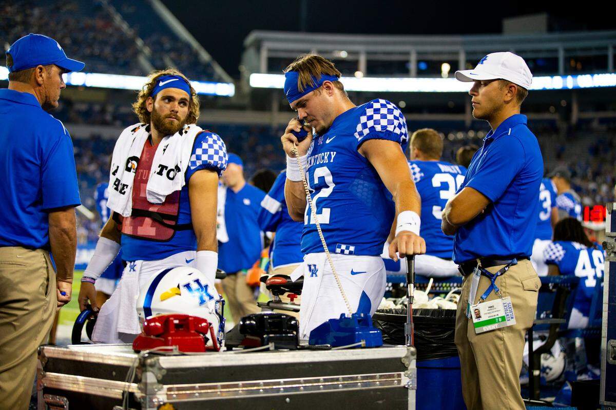 Kentucky backup quarterback Sawyer Smith (12) talked with coaches in the booth during the second half Saturday night.