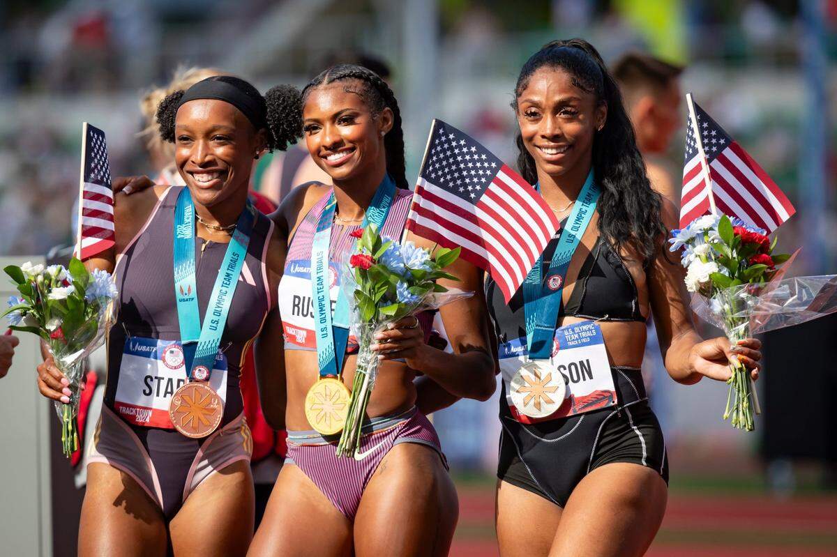 Women's 100 meter hurdle winners Masai Russell, center, Alaysha Johnson, right, and 	Grace Stark during the final day of the U.S. Olympic Track & Field Trials Sunday, June 30, 2024, at Hayward Field in Eugene, Ore.