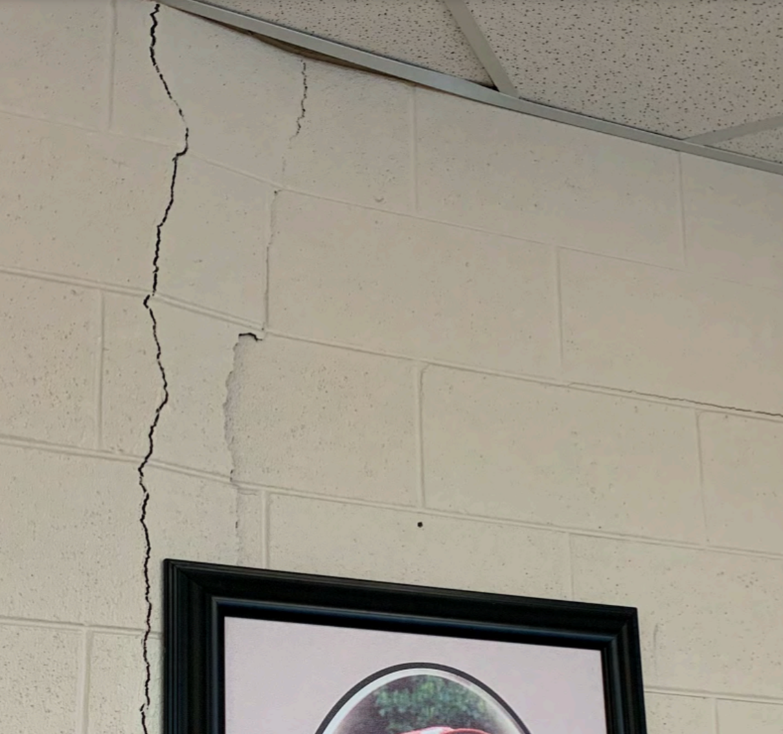 A cracked and buckling wall in the Knott County Sportsplex.