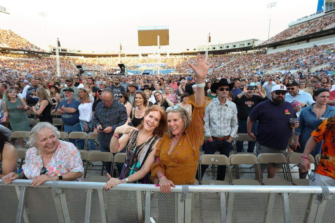 Martha Eastman, left, and Dee Schreur cheered on Willie Nelson during Chris Stapleton “A Concert for Kentucky “ at Kroger Field on April 23, 2022.