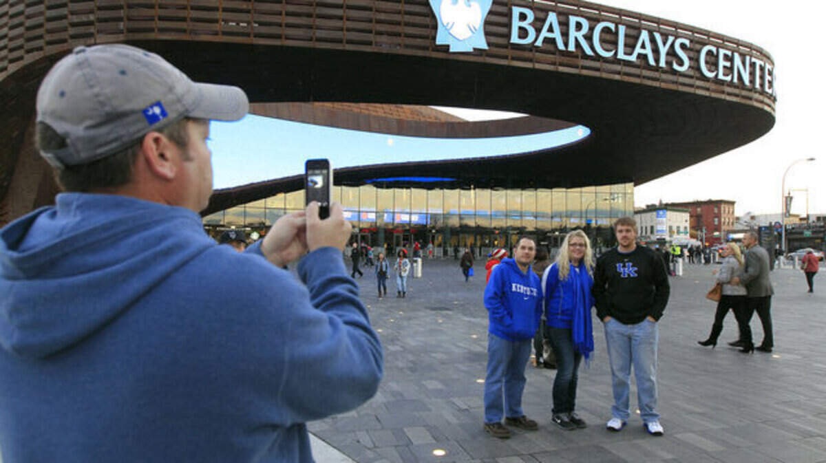 Lee Schoolcraft took a photo of L-R: Byron Crider, Angela Schoolcraft, Chris Schoolcraft, all from Prestonsburg, Ky, before the University of Kentucky played Maryland in the Barclays Center Classic held in the Barclays Center in Brooklyn, NY., Friday, November 9, 2012. Photo by Charles Bertram | Staff