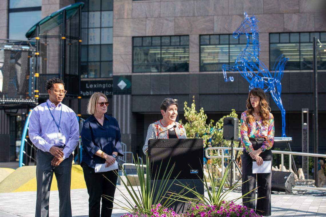 Mayor Linda Gorton speaks to the community along with Commissioner Chris Ford, left, Lexington parks & Recreation Director Monica Conrad, center left, and Third District Councilmember Hannah LeGris, right, during the reopening of Phoenix Park downtown on East Main Street. September 18, 2025.