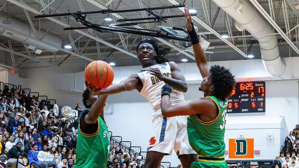 Douglass's Thurman Wade (#0) for two points during the Bryan Station vs Frederick Douglass boys basketball game at Frederick Douglass High School on Jan. 13, 2026, in Lexington, Ky.