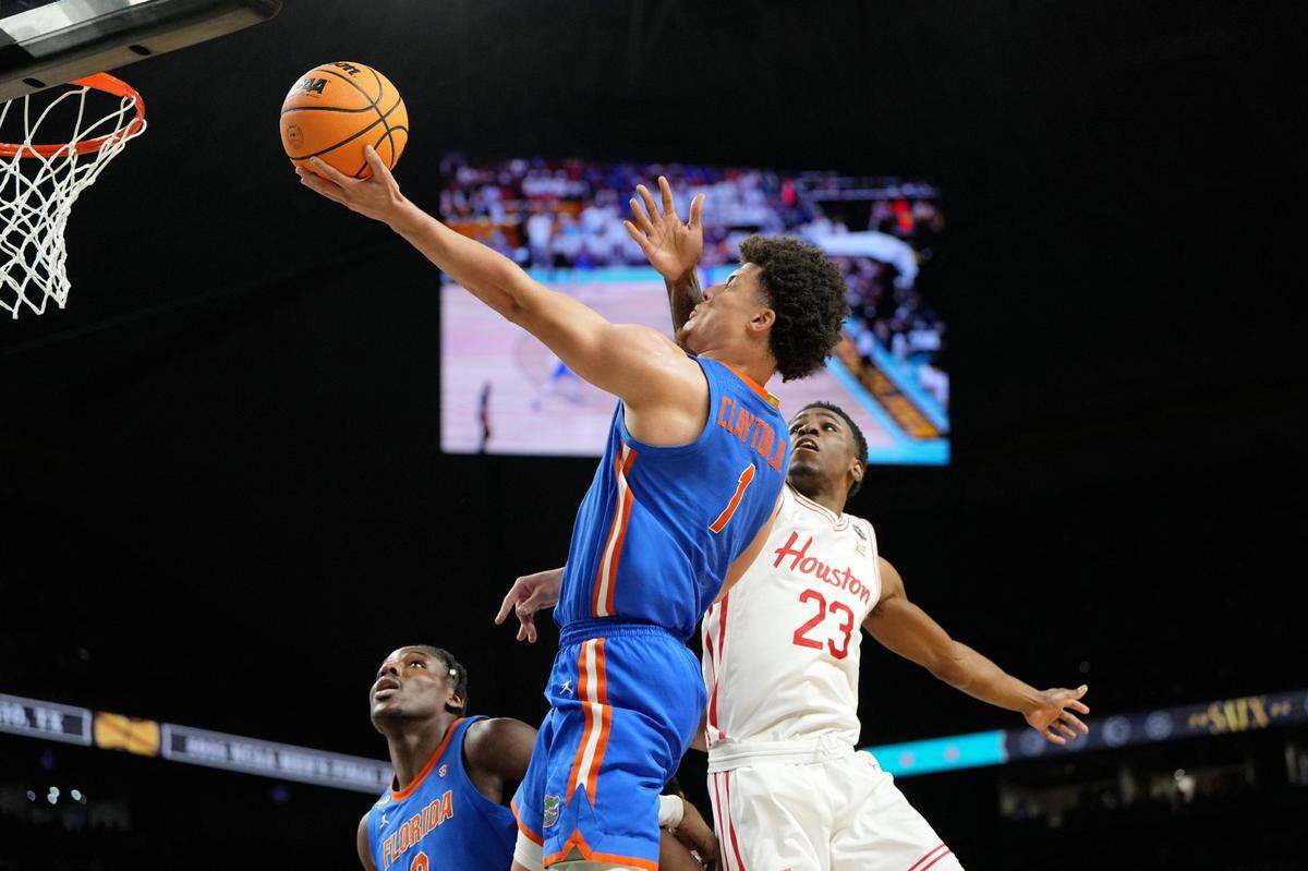 Florida’s Walter Clayton Jr. (1) drives past Houston’s Terrance Arceneaux (23) during Monday night’s national championship game in San Antonio.