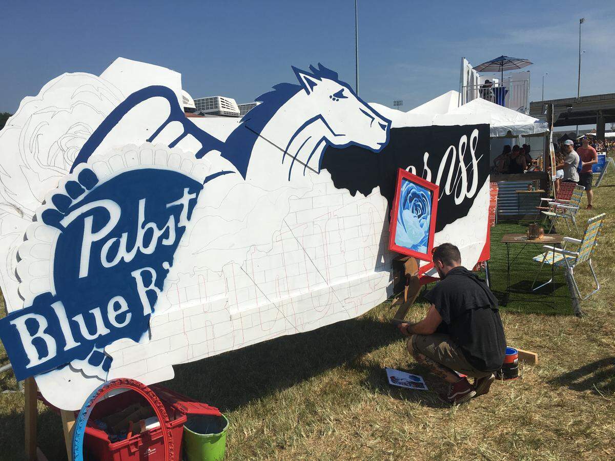 Jacob Duncan began painting a Pabst Blue Ribbon mural Friday for his mural team Often Seen Rarely Spoken.