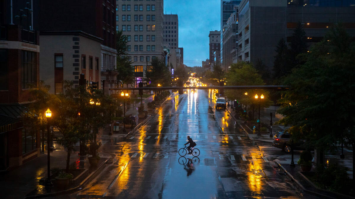 A cyclist crossed West Main Street in downtown Lexington.
