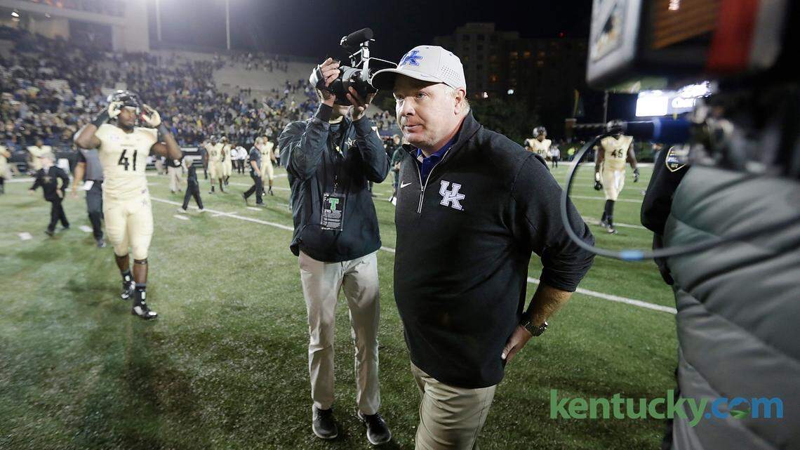 Kentucky head coach Mark Stoops walked past reporters to the locker room after the Kentucky at Vanderbilt football game at Vanderbilt Stadium in Nashville, Tenn.,, on Nov. 14, 2015. Vanderbilt beat Kentucky 21-17. Photo by Pablo Alcala | Staff