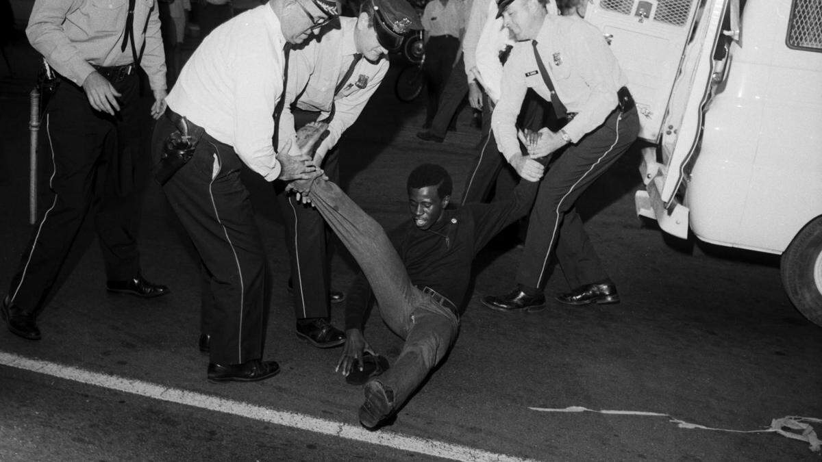 May 26, 1967; Louisville, KY, USA; An open housing protester is dragged to a paddy wagon by Louisville police. Mandatory Credit: Charles Fentress/Courier-Journal-USA TODAY NETWORK