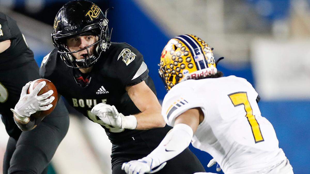 Boyle County’s Cole Lanter (6) runs past Franklin County’s Zach Claudio (7) during last season’s Class 4A state football finals at Kroger Field in Lexington. The defending state champion Rebels are 5-1 this season.