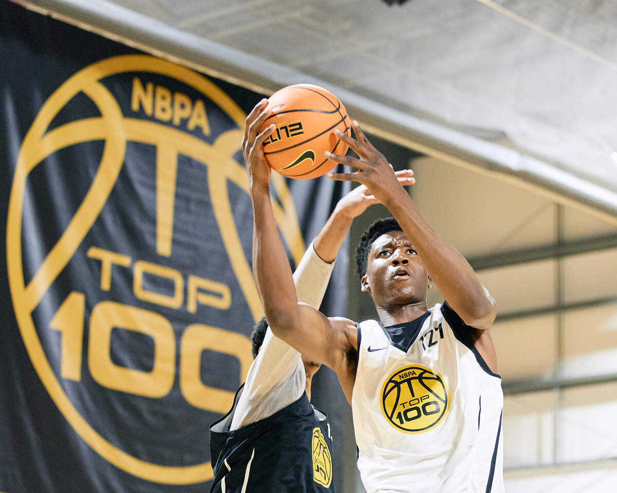 Class of 2028 college basketball recruit Yann Kamagate attempts a layup during the NBPA Top 100 Camp in Rock Hill, South Carolina.