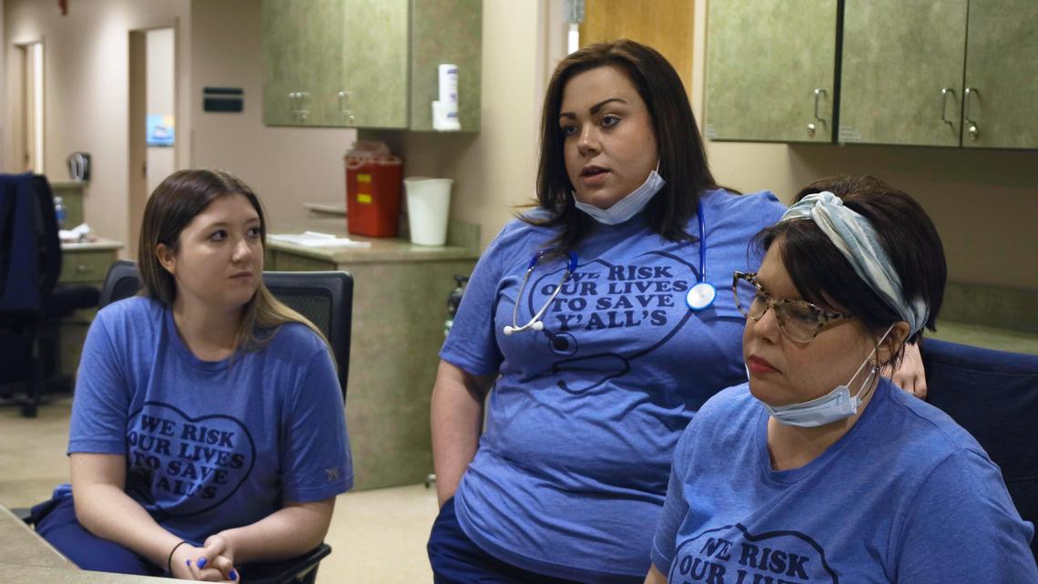 White House Clinic certified medical assistants, from left to right, Shannon Estes, Whitney Peek, and Cortnie Davidson recount the steps the clinic made to safely treat patients during the coronavirus pandemic, March 27, 2020.