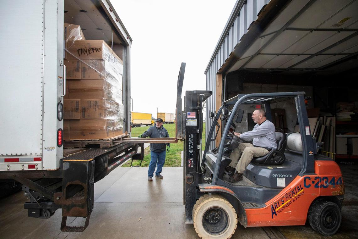 Ralph McCracken, Lexington-Fayette County Health Department preparedness coordinator, uses a forklift to unload supplies Wednesday, March 18, 2020. Fayette County received 27 pallets of personal protective equipment from the Strategic National Stockpile and state cache Wednesday.