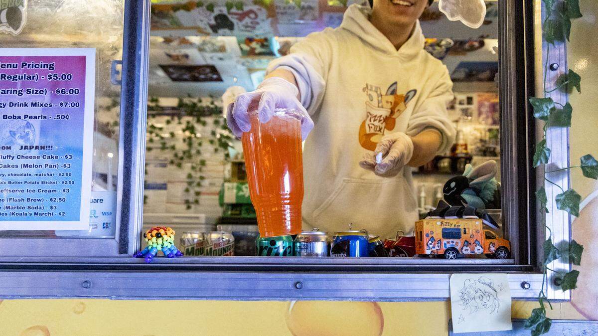 Fizzy Fox dirty soda truck has a drink menu of about 30 different flavored, custom made sodas. The dirty soda craze started in Utah and is a non-alcoholic beverage with creamer, flavored syrups and sometimes fruit to a fountain soda.