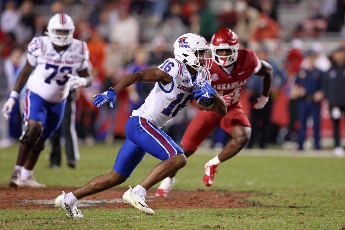 Nov 23, 2024; Fayetteville, Arkansas, USA; Louisiana Tech Bulldogs wide receiver Tru Edwards (16) runs after a catch in the fourth quarter against the Arkansas Razorbacks at Donald W. Reynolds Razorback Stadium. Arkansas won 35-14. Mandatory Credit: Nelson Chenault-Imagn Images