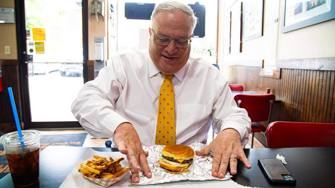 Kentucky Senate President Robert Stivers, R-Manchester, prepares to dig into a juicy burger Pat's Snack Bar on May 28, 2025, in Manchester, Ky.
