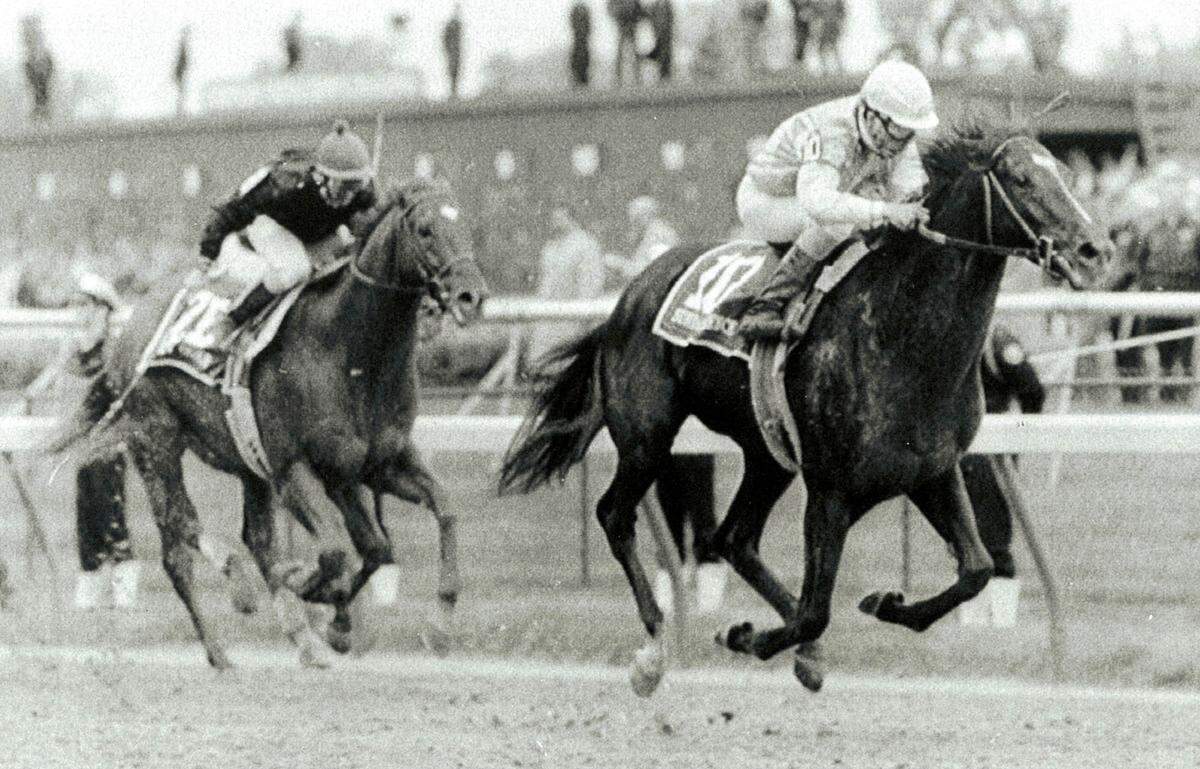 Sunday Silence, with jockey Pat Valenzuela aboard, edged past Kentucky Derby favorite Easy Goer with jockey Pat Day to win the 115th running of the Derby on May 6, 1989.