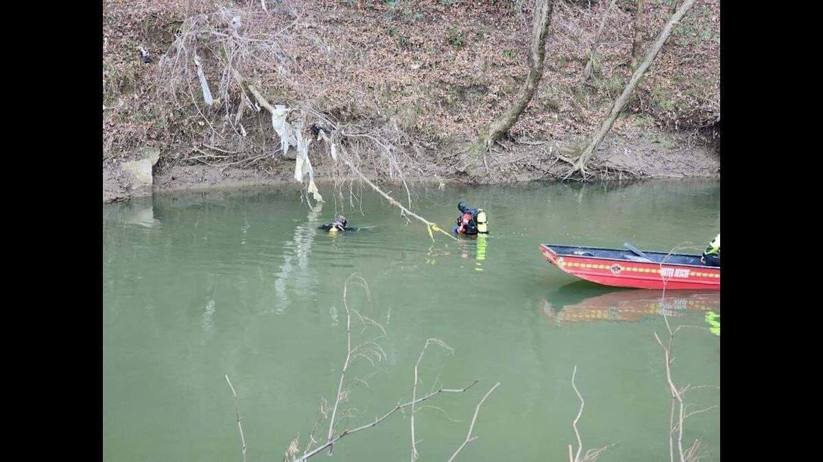Members of the London - Laurel Rescue Squad conduct a search for a missing man last seen jumping into the Kentucky River in Hazard.