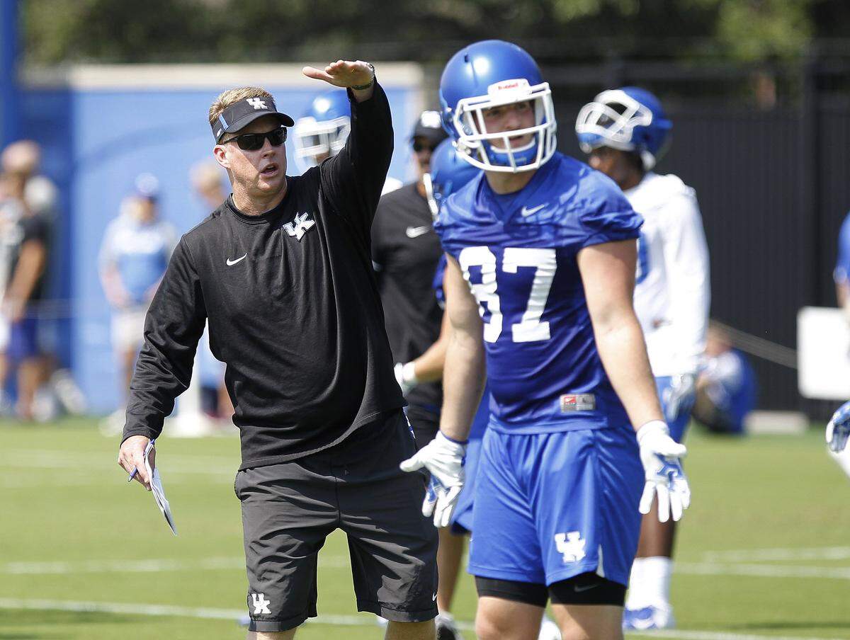Darin Hinshaw, left, has been Kentucky's quarterbacks coach and co-offensive coordinator since 2016.
