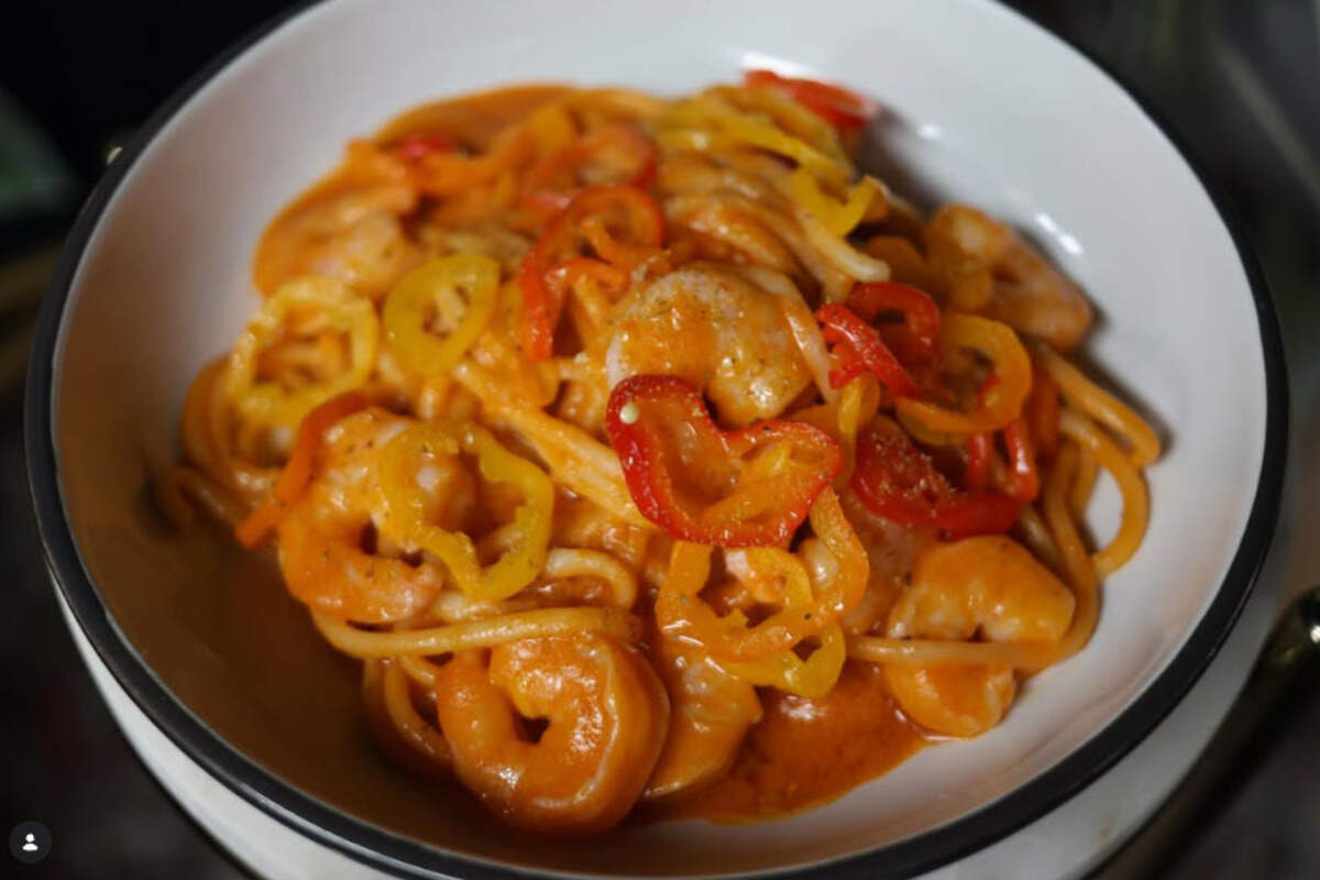 Bucatini with Shrimp & Salumi Sugo is a new pasta course item for Summer 2026 at Mileta. The dish is made with bucatini pasta tossed in a citrusy salumi sugo with shrimp, pickled peppers and fennel pollen.