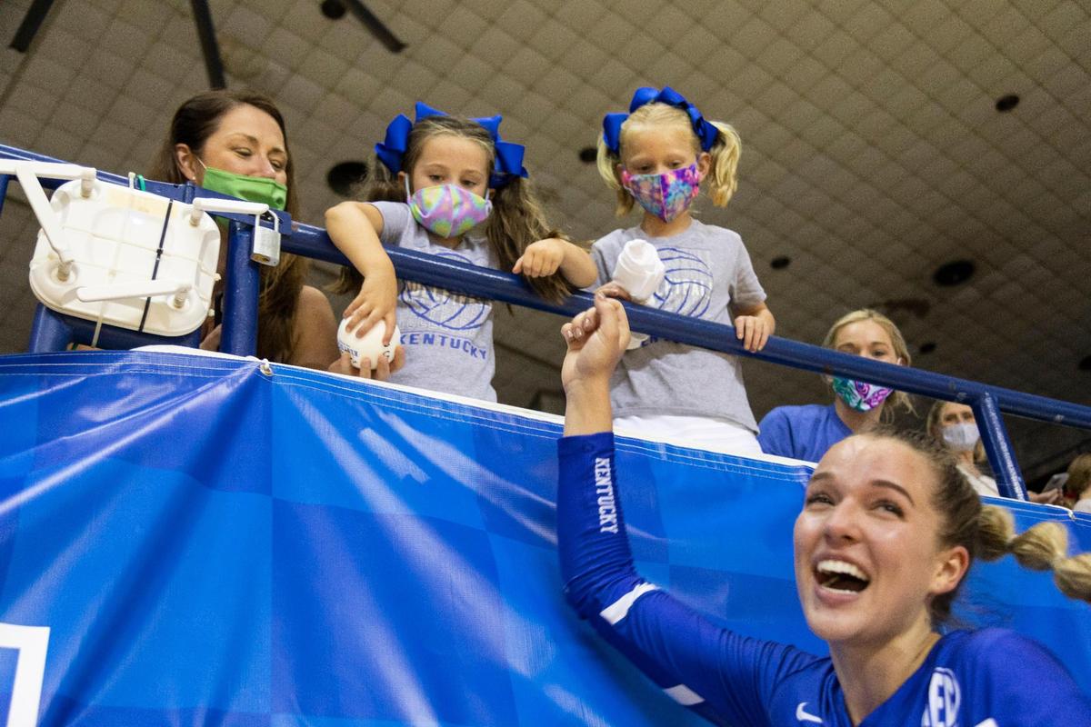 Fans get T-shirts and souvenir balls from Kentucky volleyball players after an intrasquad scrimmage in Lexington this month. Earlier this year, Kentucky became the first Southeastern Conference school to win a volleyball national championship.