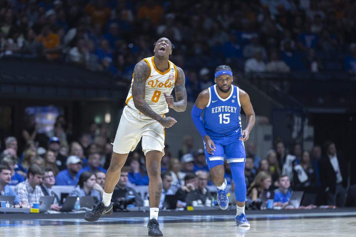 Tennessee’s Darlinstone Dubar (8) celebrates in front of Kentucky’s Ansley Almonor during the teams’ Sweet 16 game at Lucas Oil Stadium in Indianapolis on Friday.