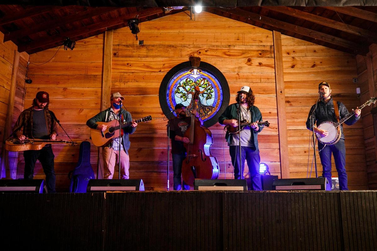 The Wooks’ Allen Cooke, from left, C.J. Cain, Johnny Calamari, Harry Clark and George Guthrie rehearse Wednesday for their Halloween show at The Burl, Wook-O-Ween, an outdoor concert this Saturday at The Burl.