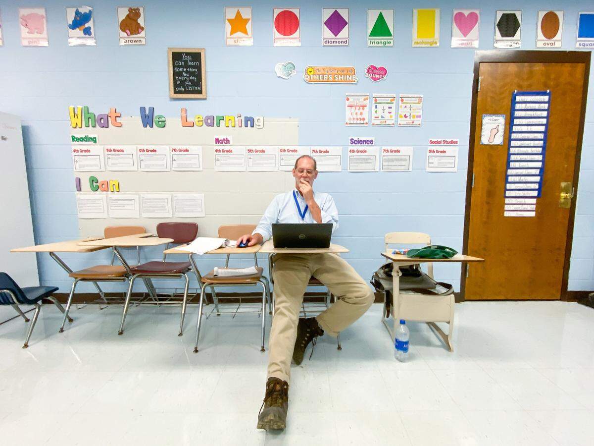 Lexington Herald-Leader Somerset bureau chief Bill Estep files a story following President Joe Biden’s visit to Marie Roberts Elementary School in Lost Creek, Ky., on Monday, Aug. 8, 2022. Biden visited to survey damage caused by massive flooding in Eastern Kentucky.