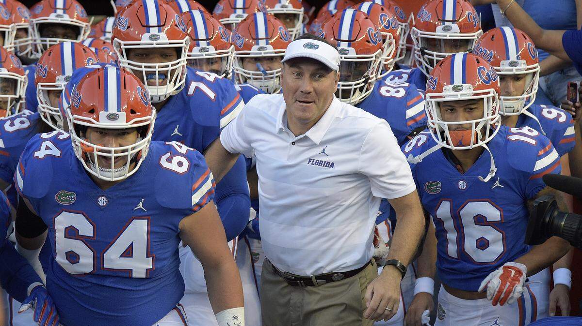 Florida coach Dan Mullen leads the Gators out to the field at Ben Hill Griffin Stadium.