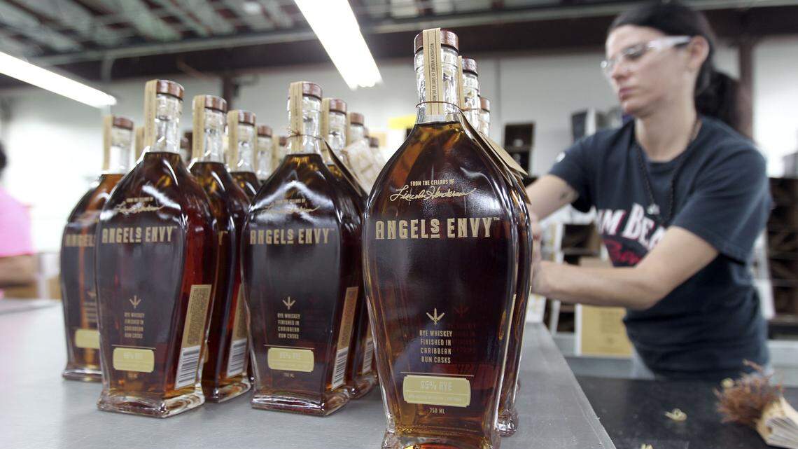 Stacey Call prepared to box bottles of Angel's Envy Rye Whiskey finished in Caribbean Rum casks in July 2013.  
