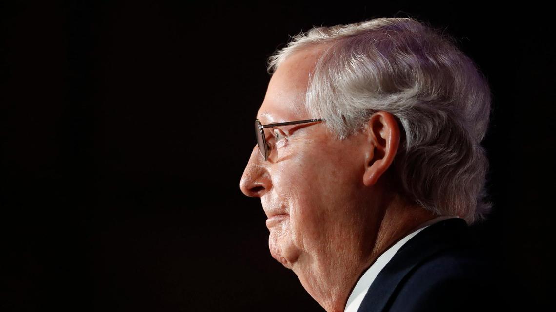 Republican Senate Majority Leader Mitch McConnell, standing with his wife Elaine Chao, gives remarks after winning reelection over Democratic challenger Amy McGrath at the Omni Hotel in Louisville, Ky., Tuesday, Nov. 3, 2020.