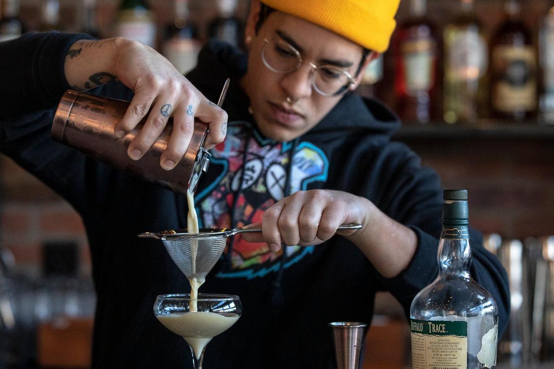 Bartender Alec Carrillo made a bourbon flip at East End Tap and Table Wednesday.