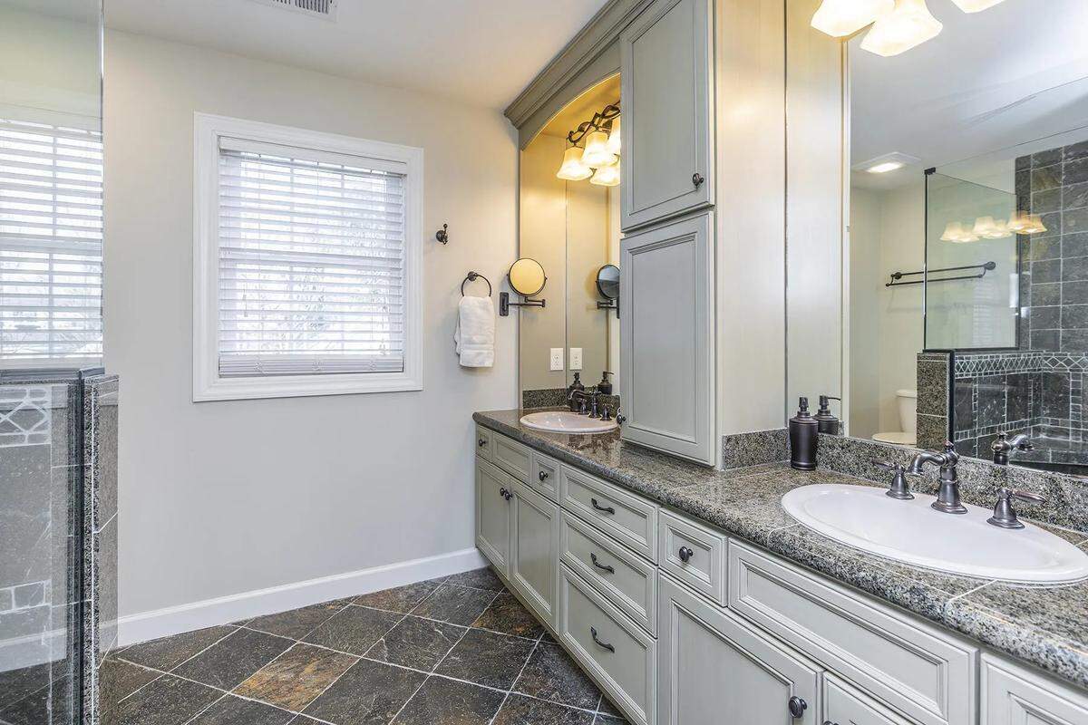Primary bathroom for upstairs bedroom at 403 Queensway Drive.