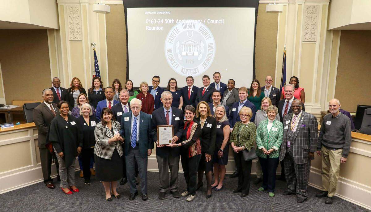 Former mayors and council members during a reception celebrating the 50th anniversary celebration of the start of Lexington’s merged government at the Government Center March 21, 2024.