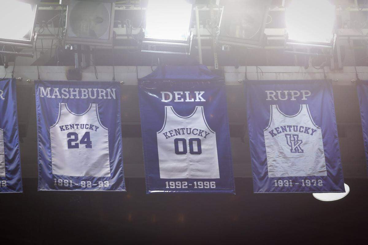Jamal Mashburn’s No. 24 jersey, left, has been retired and hangs in the rafters at Rupp Arena.