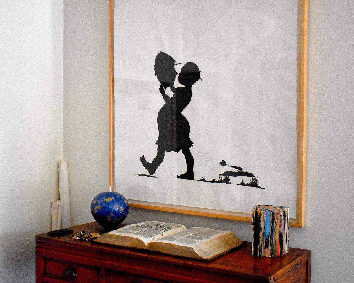 Jim Gray’s collection includes this provocative piece by the prominent African-American artist Kara Walker, featuring the silhouette of a black woman apparently in conversation with the severed head of a Civil War soldier.