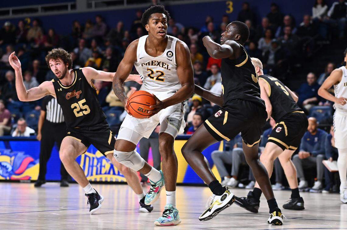 Feb 2, 2023; Philadelphia, Pennsylvania, USA; Drexel Dragons forward Amari Williams (22) drives against Charleston Cougars forward Babacar Faye (35) in the second half at Daskalakis Athletic Center. Mandatory Credit: Kyle Ross-USA TODAY Sports