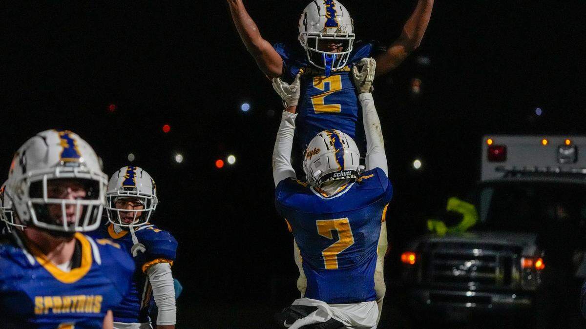 Brock Coffman (2) celebrates after running back a punt for a touchdown for Sayre’s first score Friday night against Pikeville.
