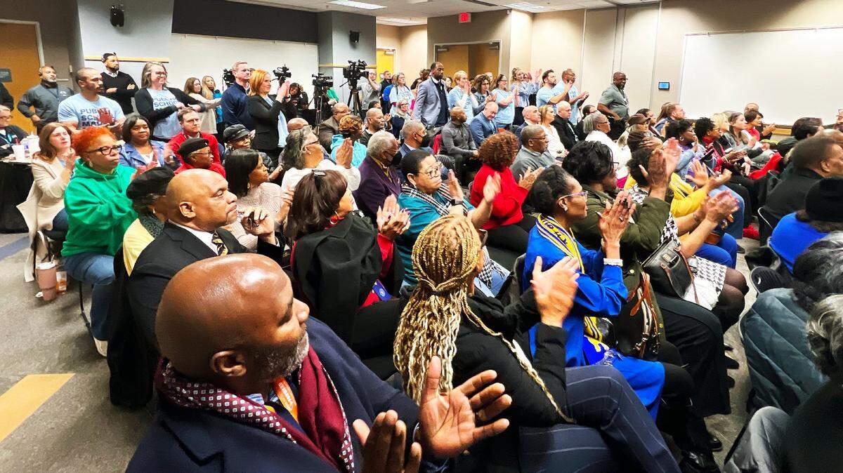The audience applauds teachers standing in solidarity, supporting Fayette Superintendent Demetrus Liggins’s contract renewal during the Fayette County Public School Board vote to renew his contract on January 27, 2025, at the Fayette County Public Schools Central office in Lexington, Ky.