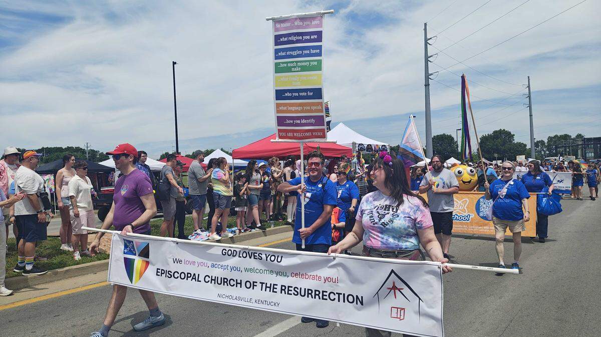 Members of the Episcopal Church of the Resurrection in Nicholasville, Kentucky march at the kick-off parade for the 2026 Lexington Pride Festival.