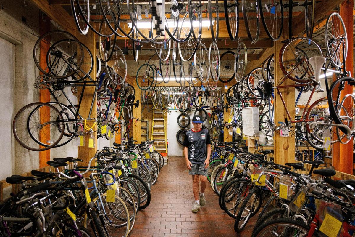 Rufus Godbey walks through the donated bikes for sale on Sunday, May 22, 2022, at Broke Spoke Community Bike Shop in Lexington, Kentucky.